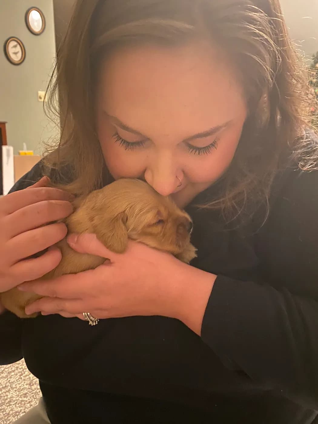 Tammy with a newborn Golden puppy